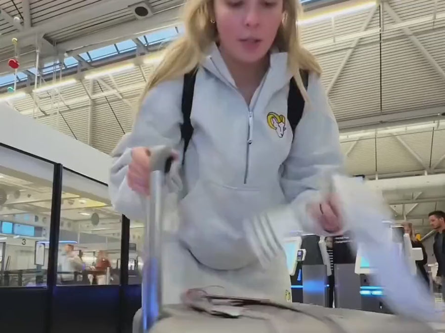 Checking a big suitcase at the airline counter