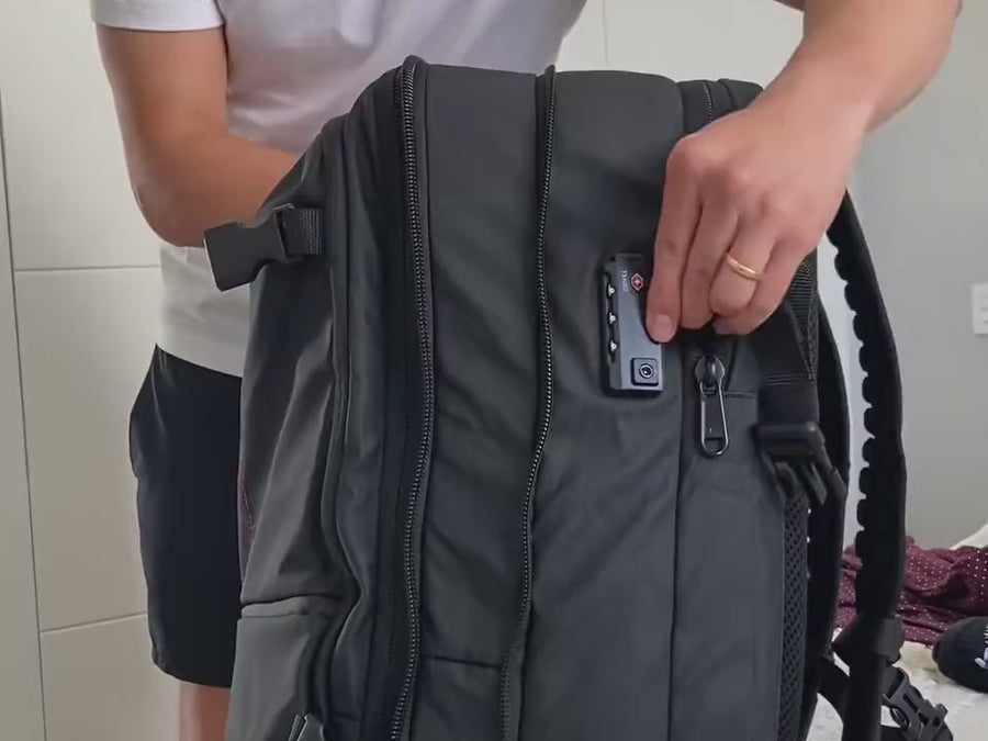 TSA-compliant side lock and hidden back pocket