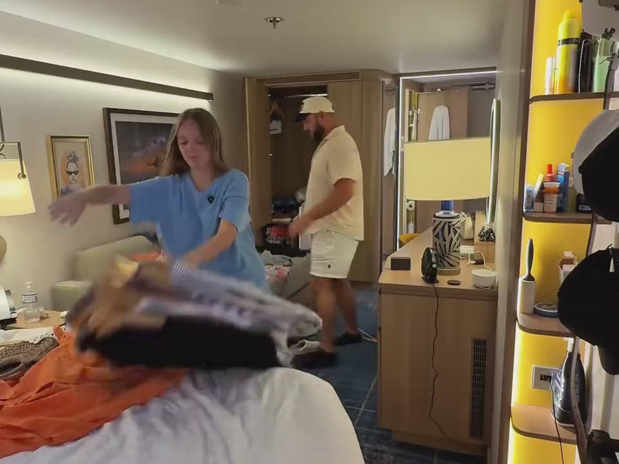 Packing up clothes in a hotel room on checkout day